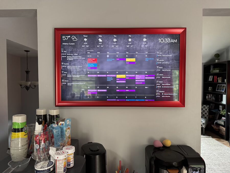 A large on-wall display showing the time and weather.